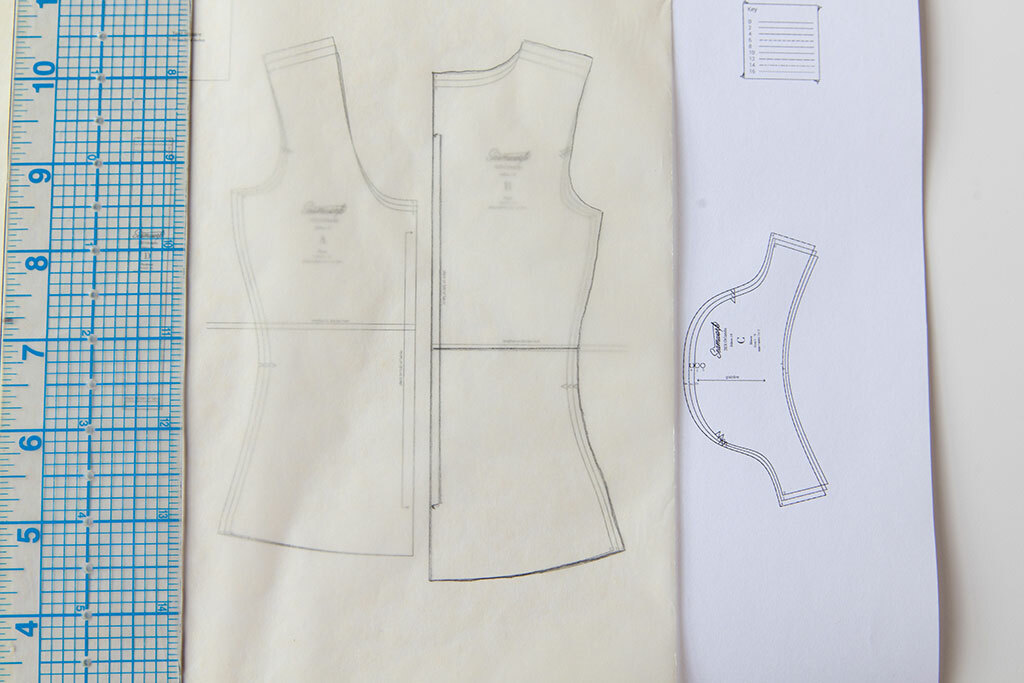 Fabric and sewing pattern. Paper pattern, a lot of fabric, tape