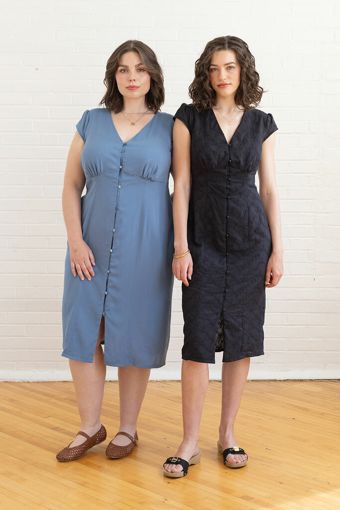 woman in blue lilac dress and woman in black lilac dress modeling