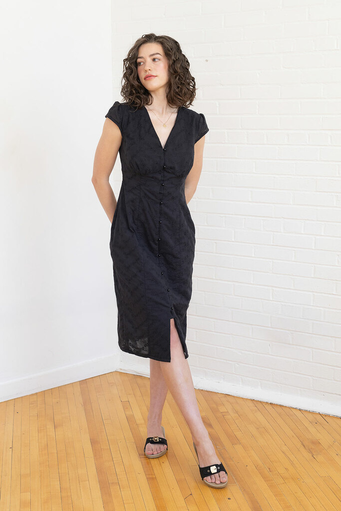 woman posing in black lilac dress