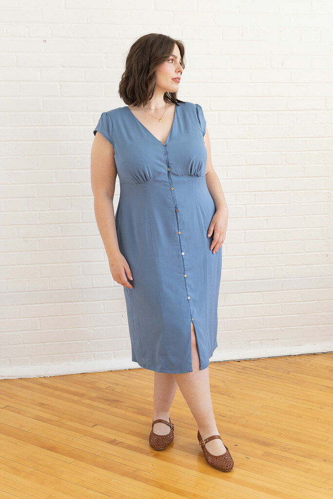 woman posing in blue lilac dress