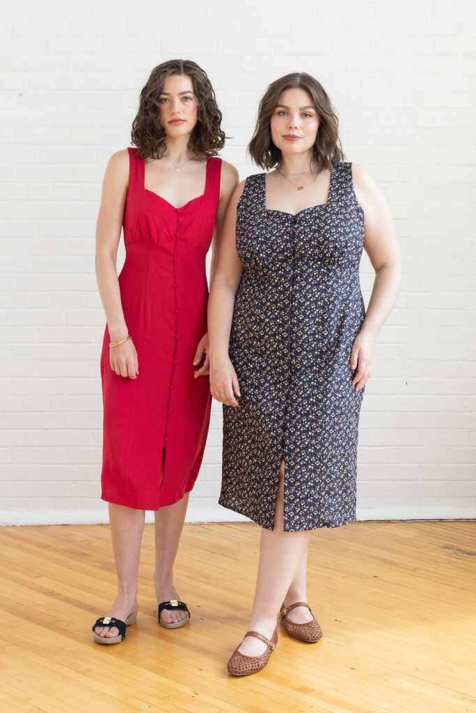 two women wearing lilac dresses