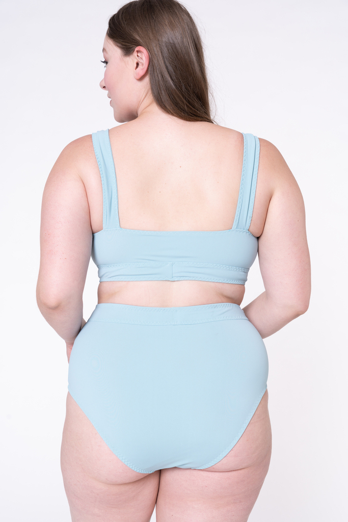 woman wearing Maggie swimsuit back