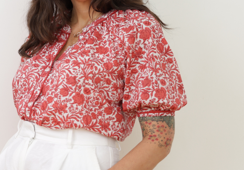 close-up showing the piping detail on the center front placket