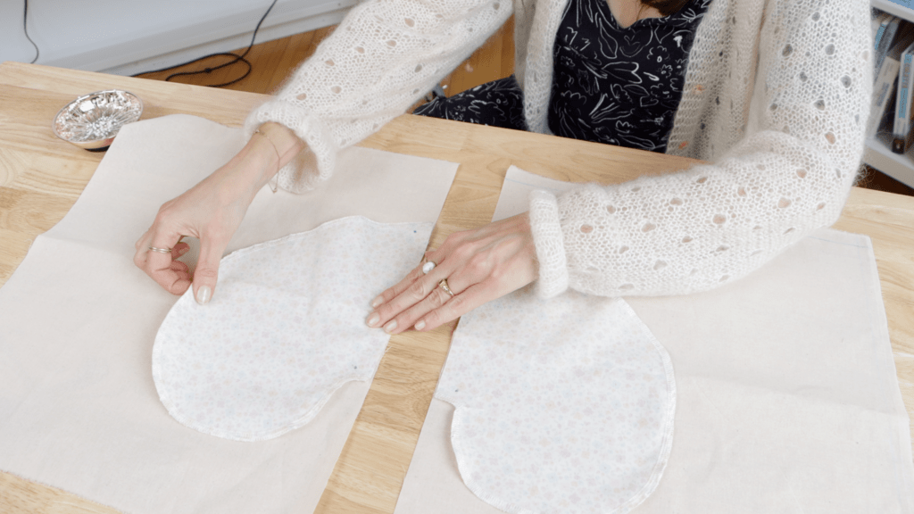 Pocket pieces pinned to front and back pattern pieces, showing proper alignment