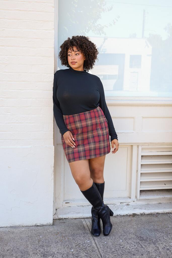 woman modeling checkered Orla mini skirt