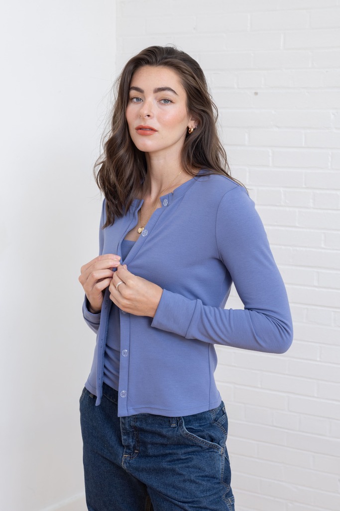 woman wearing blue Fig cardigan
