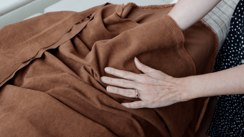 brown corduroy fabric draped showing texture and color