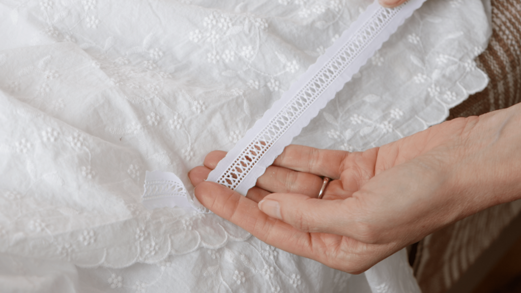 white eyelet fabric with ladder lace insertion trim
