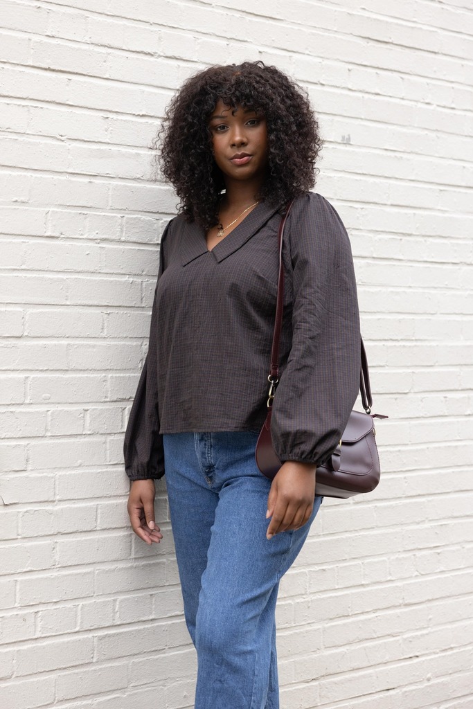 Woman modeling brown Cosmo blouse