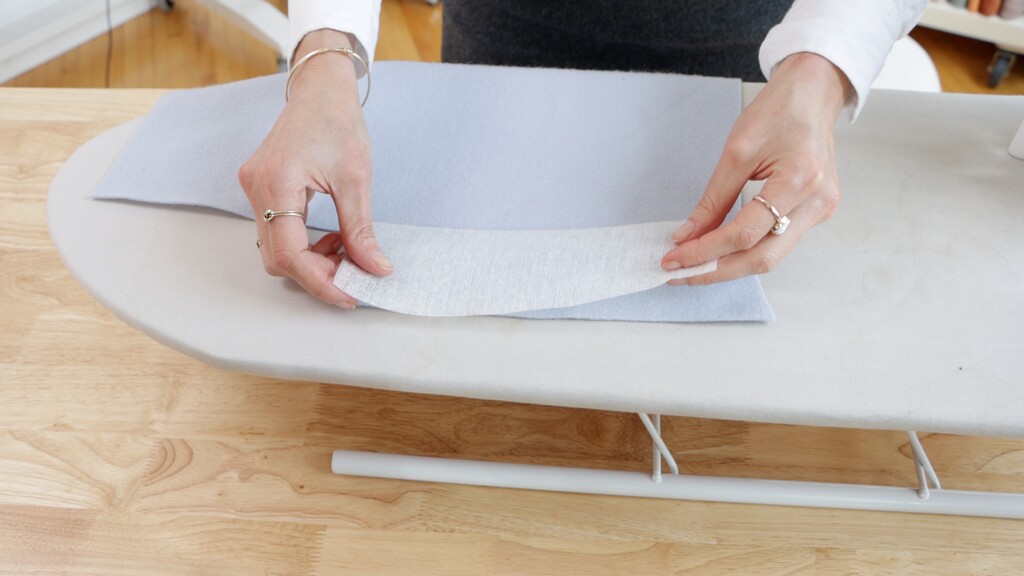 Close-up of hem with interfacing being applied