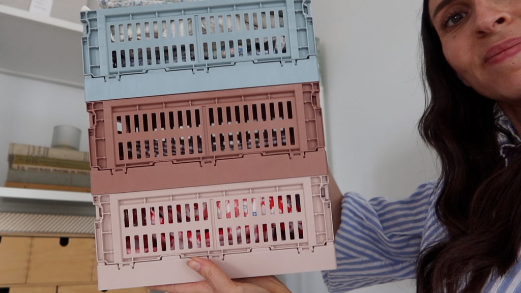 organized fabric stash with labels showing specific projects for each fabric