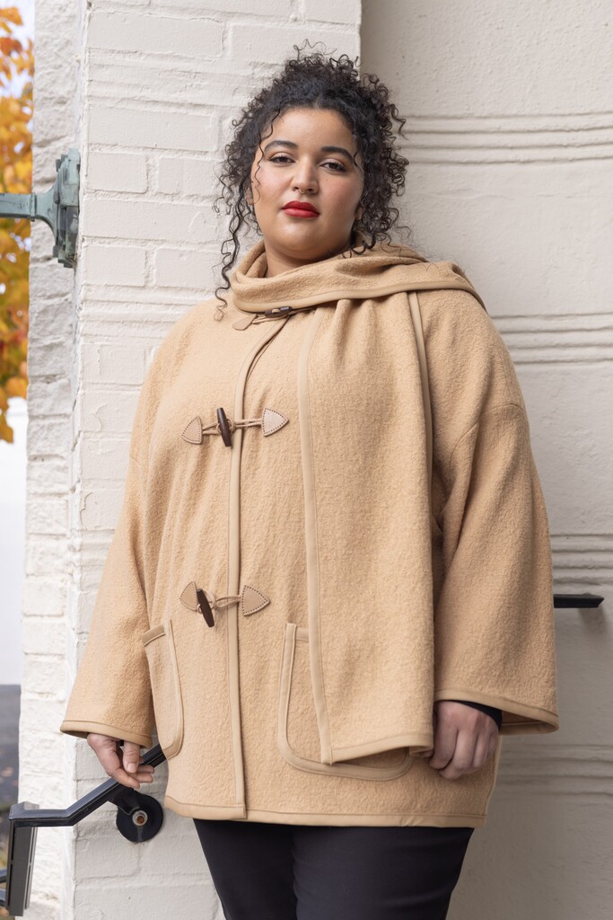 woman modeling camel Ivy coat outside