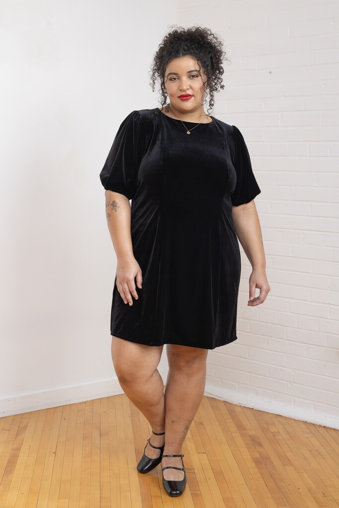 woman wearing a black Pomme dress