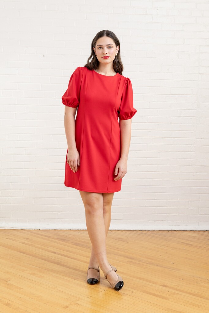 woman wearing a red Pomme dress