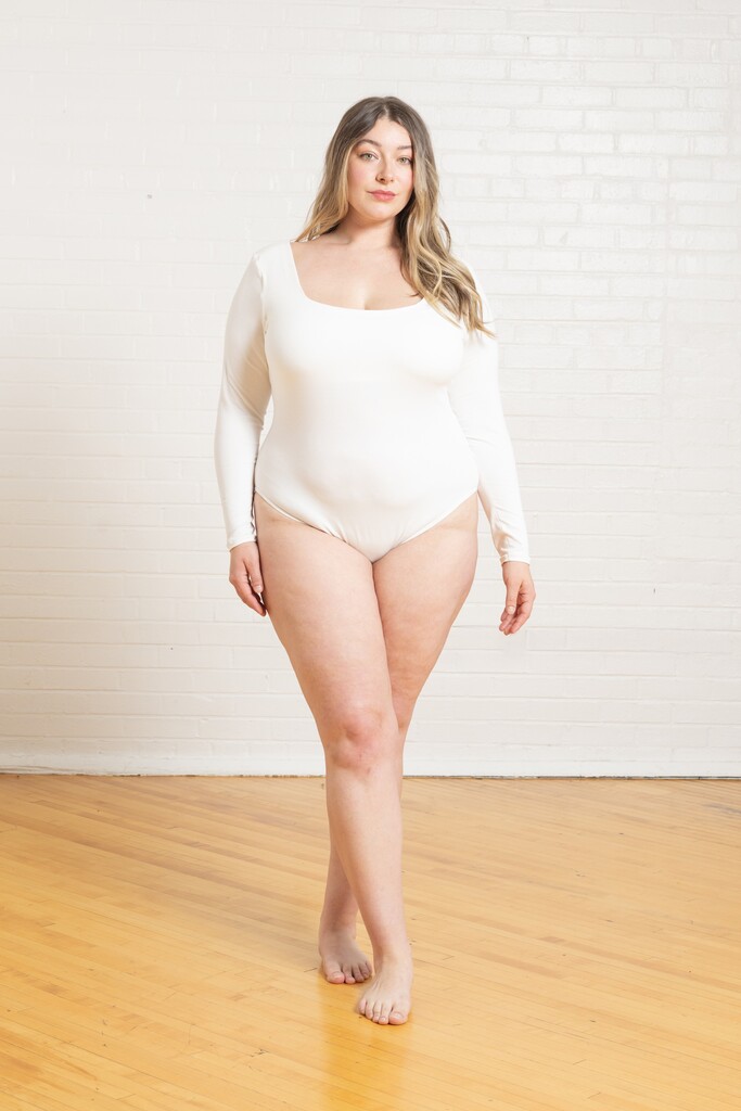 Model wearing the white Ione bodysuit