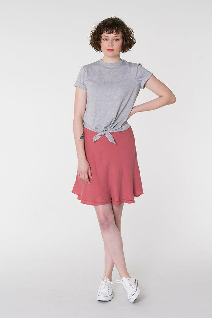 Woman modeling the Everly bias mini skirt
