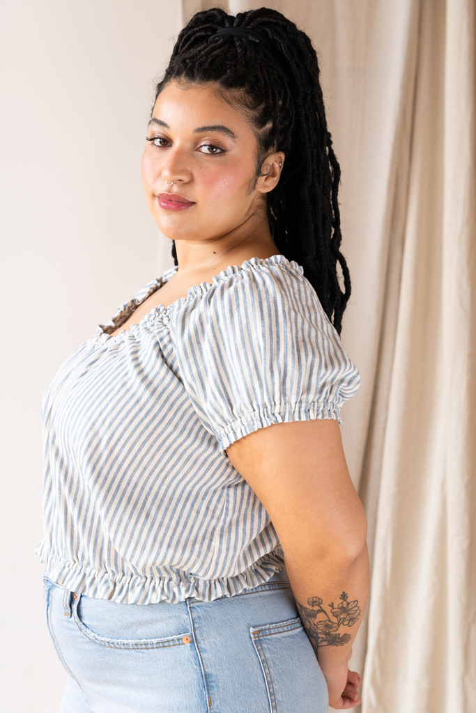 Woman modeling Madhu top side view