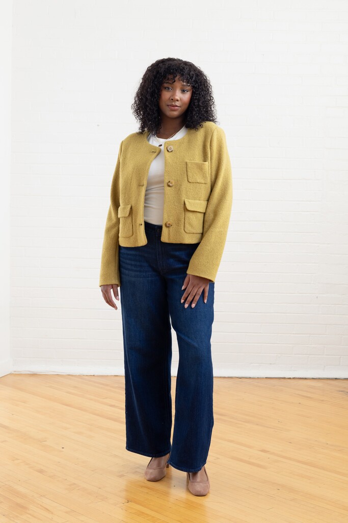 Model wearing the checkered Rhoda jacket