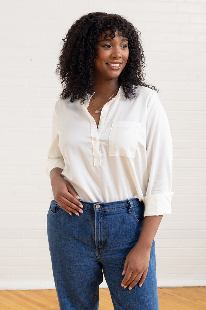Woman wearing a white Thyme shirt