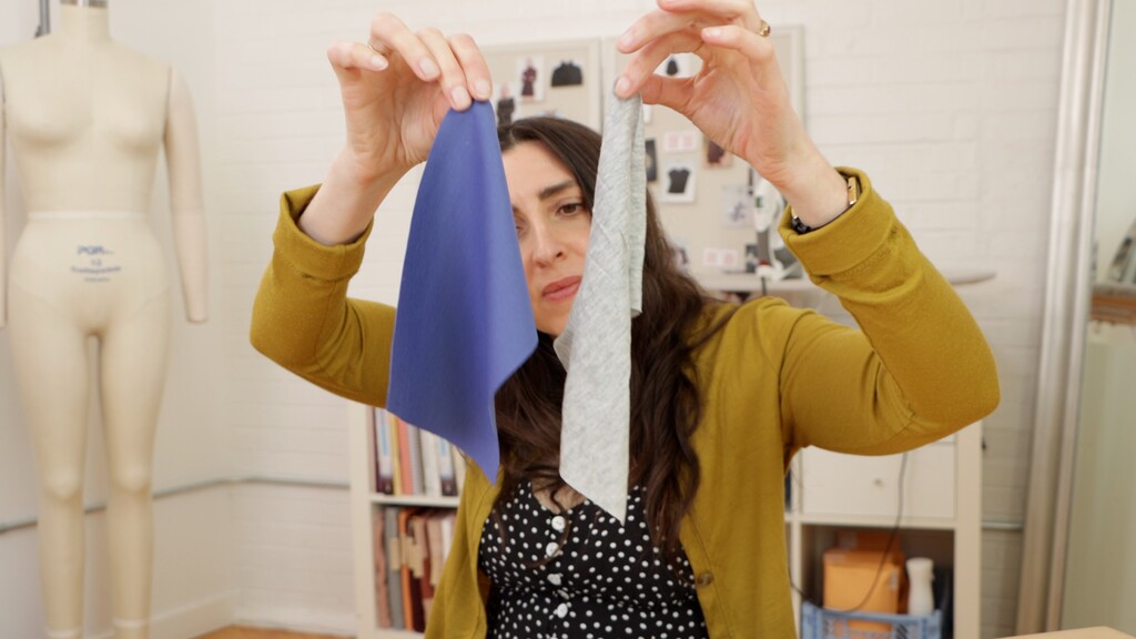 Fabric stability test showing a stable knit hanging without distortion next to an unstable knit that's visibly stretching under its own weight