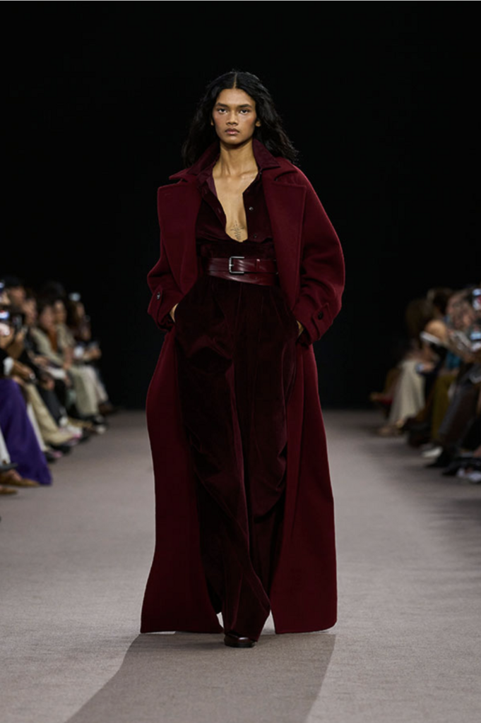 Floor-length coat showing dramatic proportions and movement