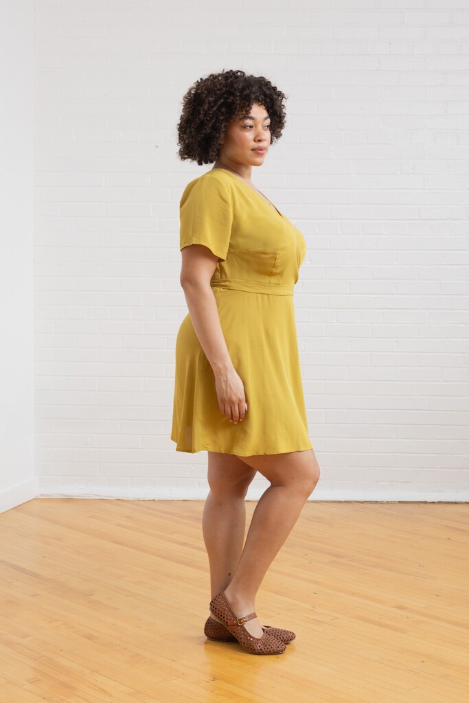 Woman modeling lime green Posie dress