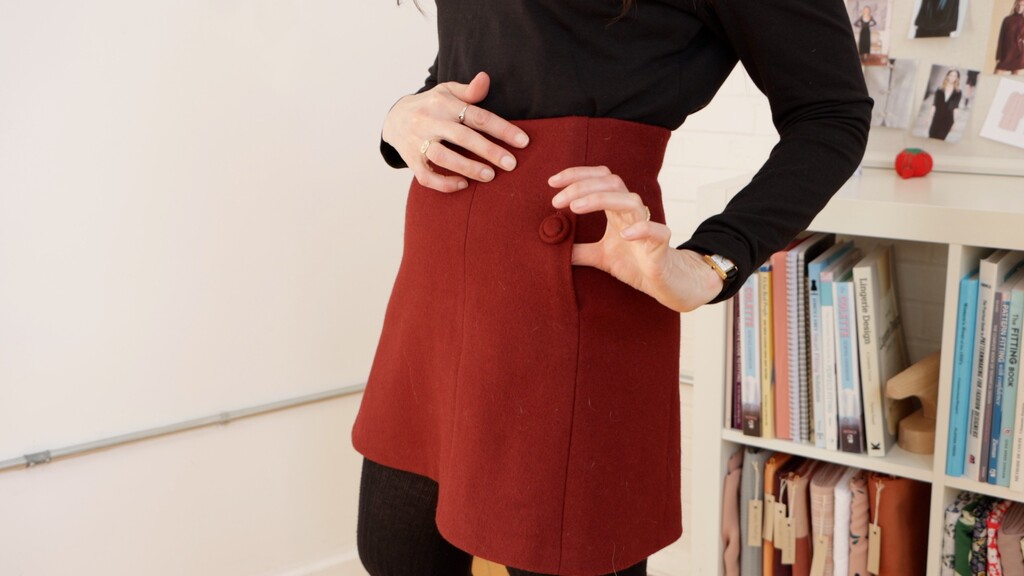 Vintage couture garment detail showing Singleton-style button