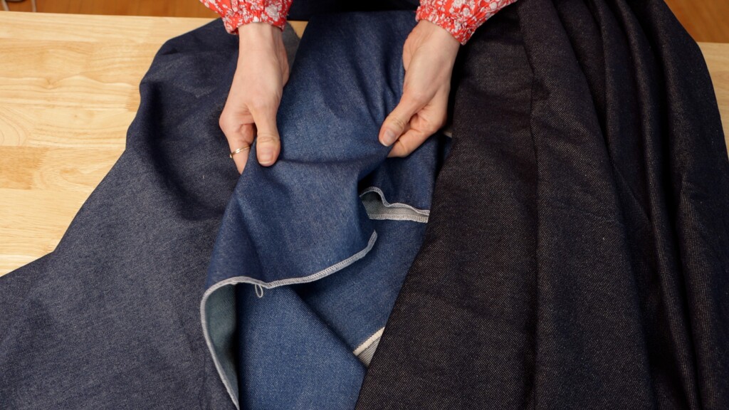 Three fabric swatches showing the drape difference between lightweight, medium-weight, and heavyweight denim