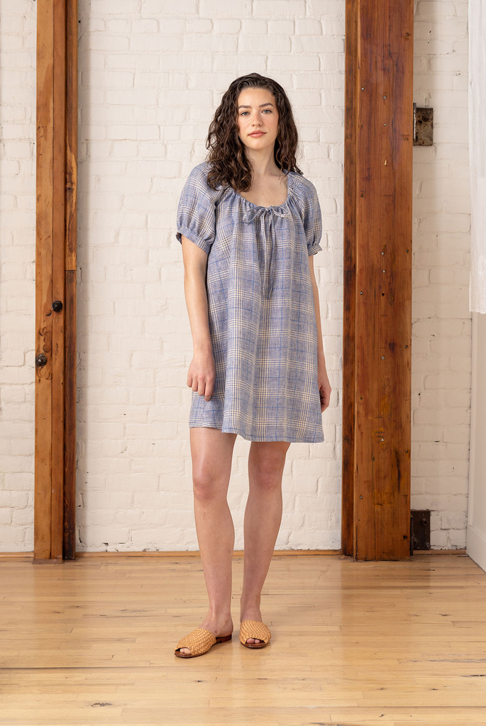 model wearing light blue linen pearl dress