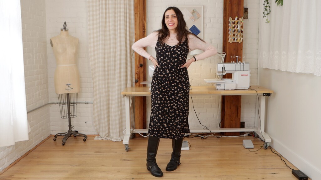 Sarai wearing one of her Ash dresses, styled casually with a cardigan