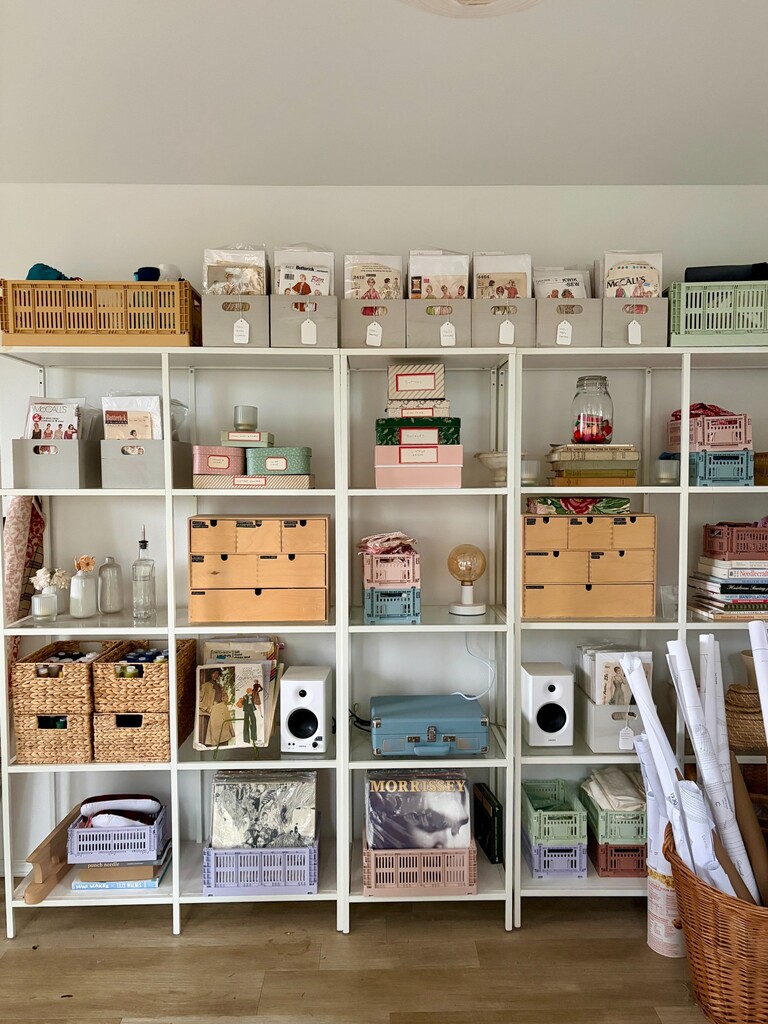 After photo of cluttered sewing room with fabric scraps, tools, and notions scattered across surfaces