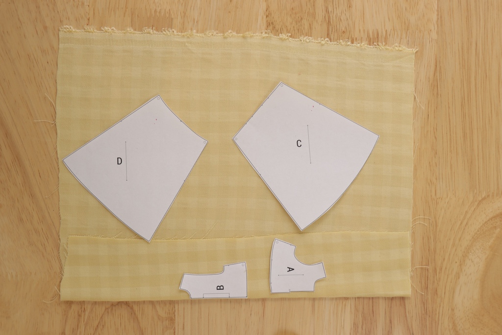 Pattern layout showing Freesia bodice pieces on straight grain and skirt pieces positioned on bias grain