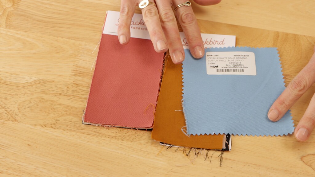 Fabric swatches laid out showing different fiber types with labels
