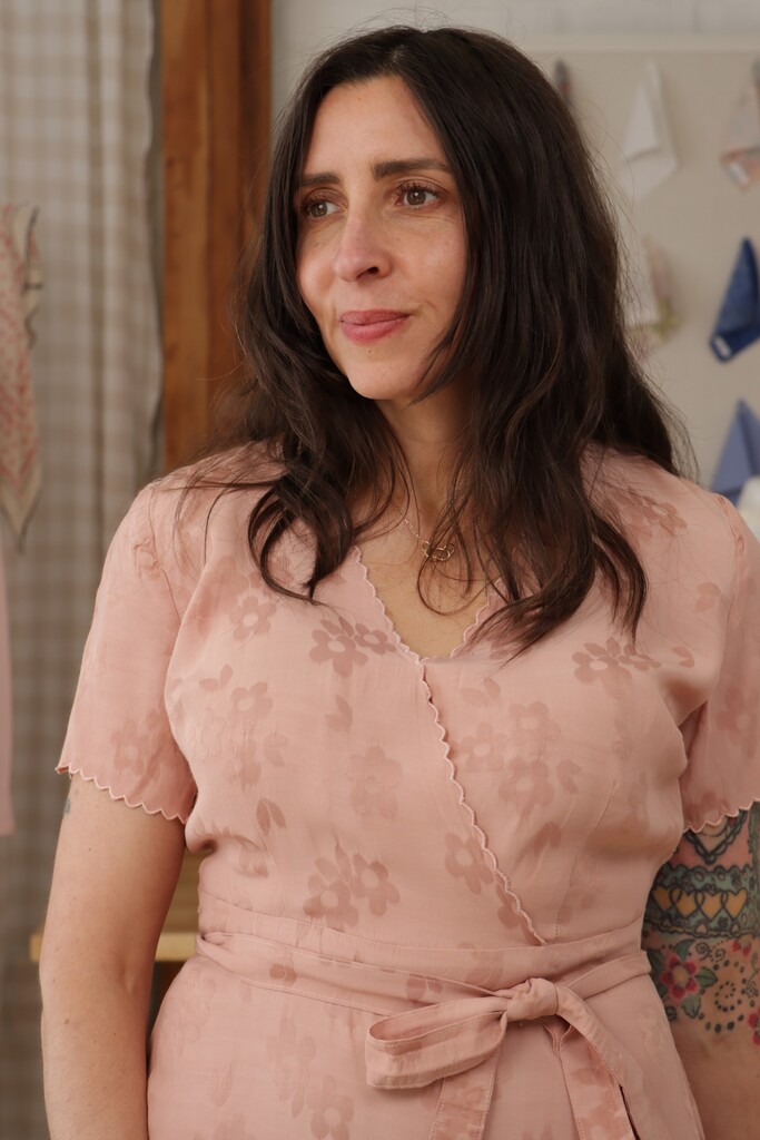 The rayon jacquard Posie dress, close-up of the machine scalloped hem detail