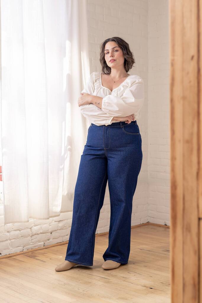 Woman modeling dark blue Vallie jeans