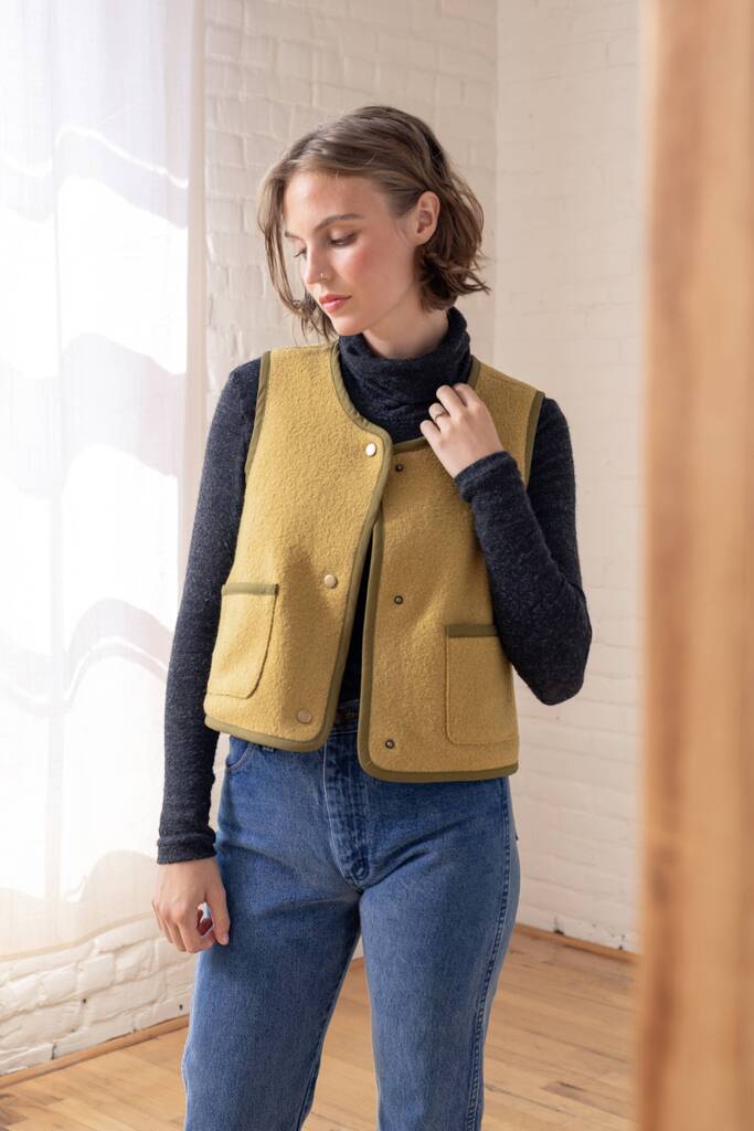 Model wearing an olive green Moss vest