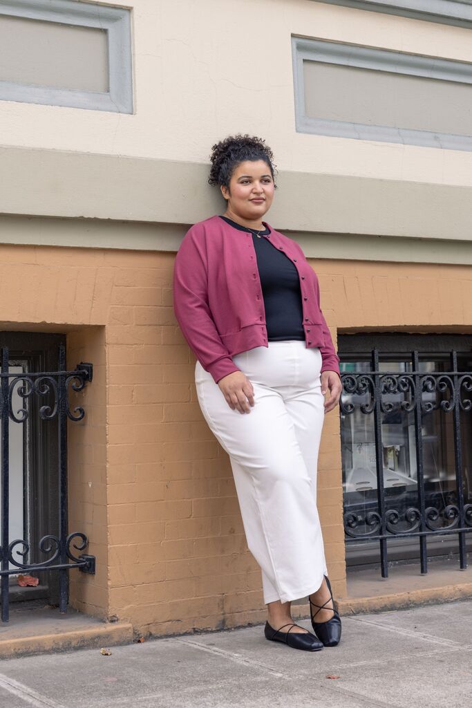 Woman modeling pink Opal cardigan