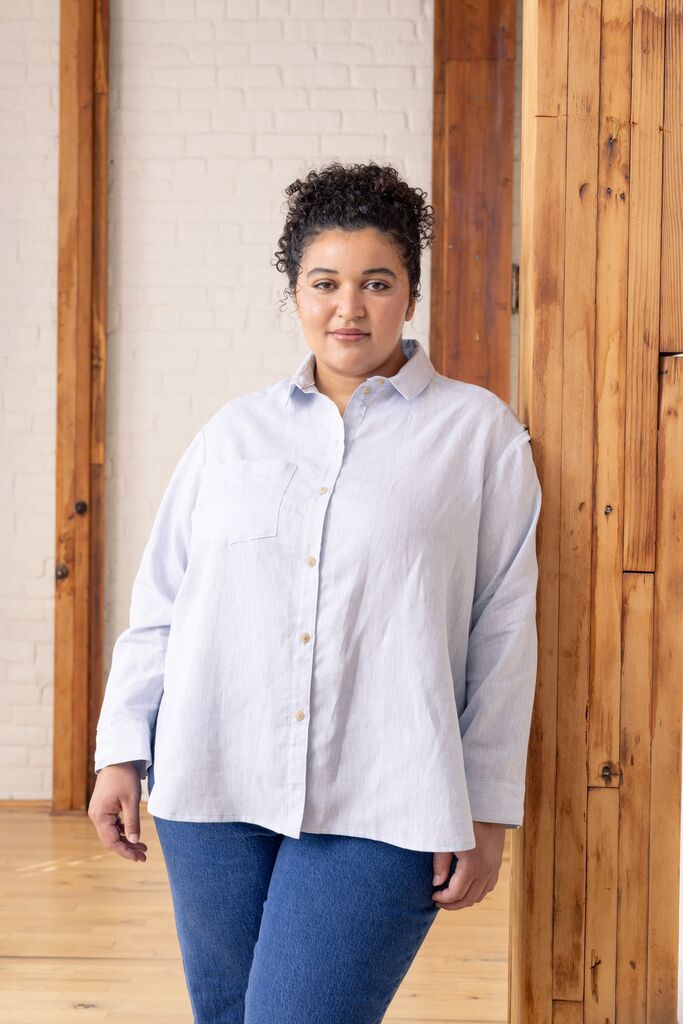 Woman modeling a light-blue Grove shirt