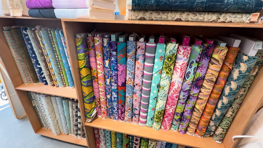 A stack of various fabrics