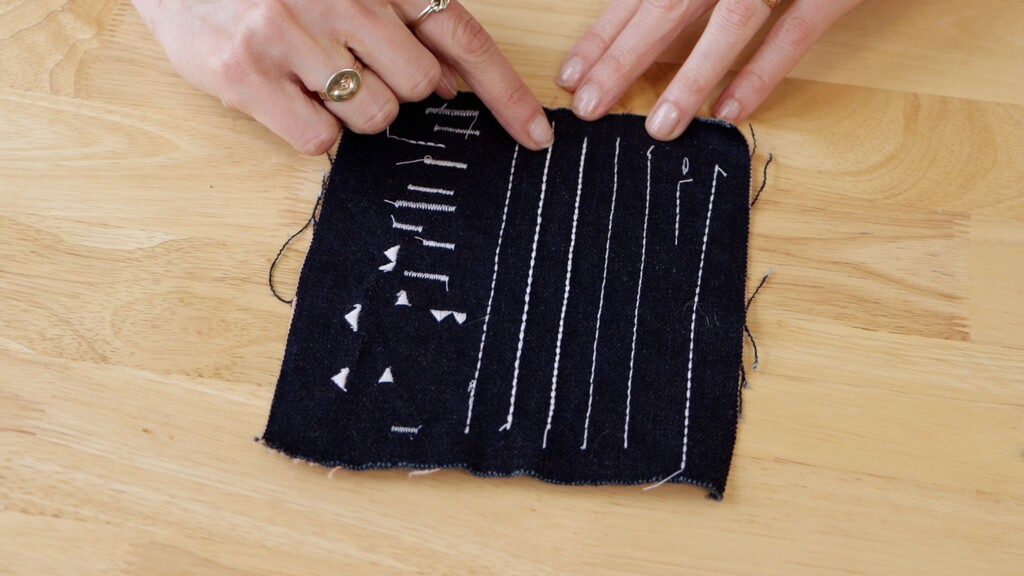 Test swatches comparing regular topstitching thread, Gütermann Mara 70, and a triple stitch on dark denim