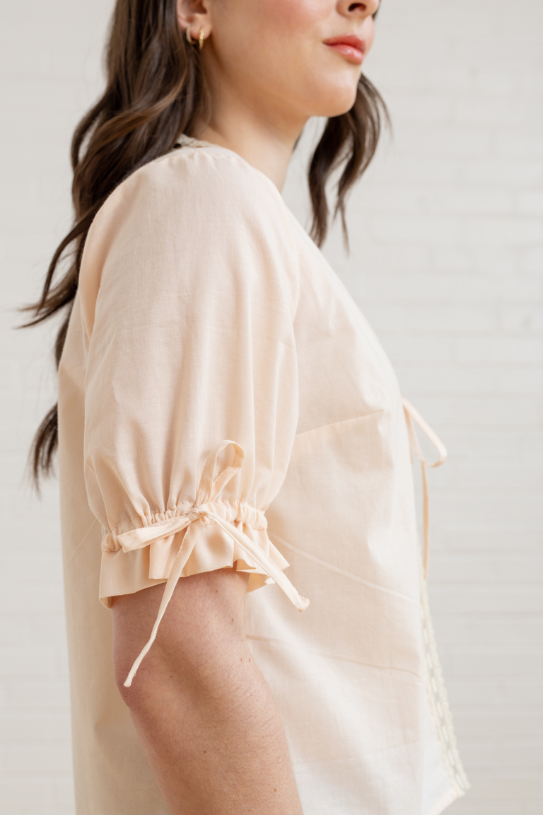 The Orchid Puff Sleeve Tie Front Top sewing pattern, from Seamwork